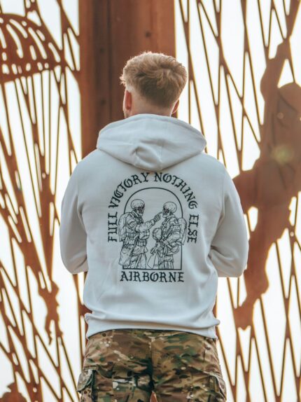 Hoodie featuring World War II design of two soldiers standing before a parachute jump
