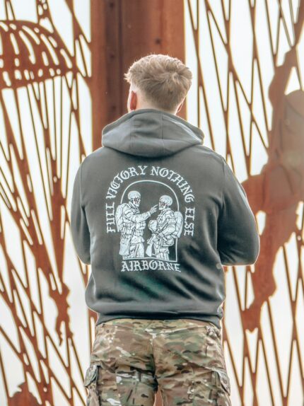 Hoodie featuring World War II design of two soldiers standing before a parachute jump