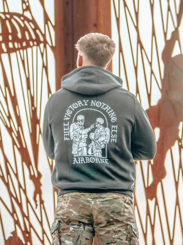 Hoodie featuring World War II design of two soldiers standing before a parachute jump