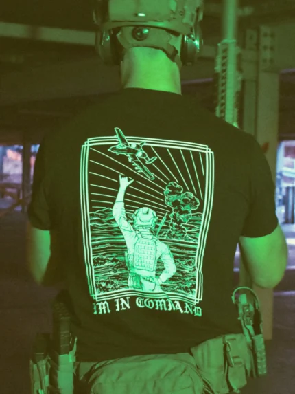 the trace apparel collection featuring a fst jtac guy standing in front of a firing plane