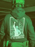 the trace apparel collection featuring a fst jtac guy standing in front of a firing plane