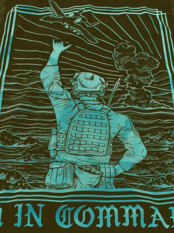 the trace apparel collection featuring a fst jtac guy standing in front of a firing plane