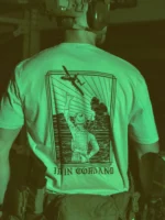 the trace apparel collection featuring a fst jtac guy standing in front of a firing plane