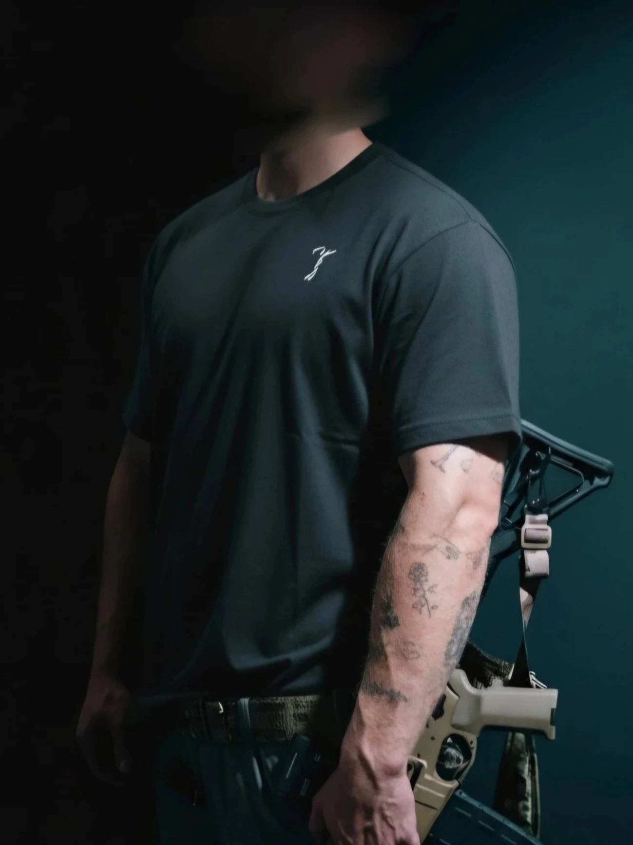 the trace mockup clothing featuring their T logo on the chest and a weapon on the hand