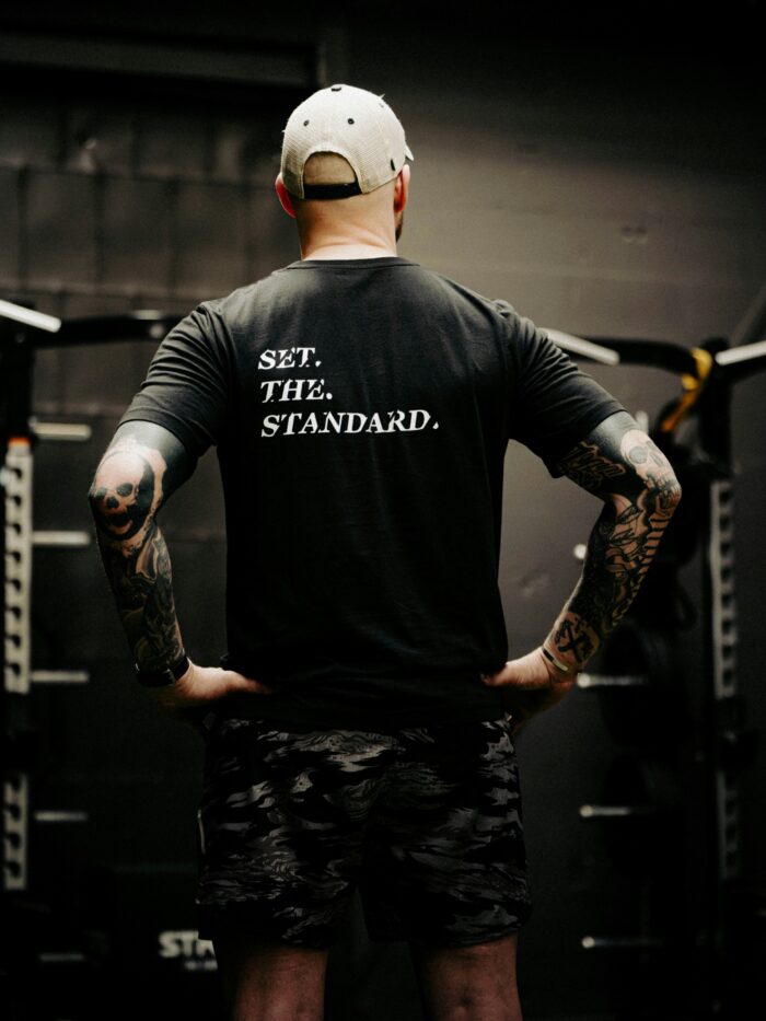 Black T-shirt from The Trace featuring Set the Standard design symbolizing the pursuit of the highest performance