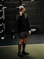 Black hoodie from The Trace featuring Set the Standard design symbolizing the pursuit of the highest performance