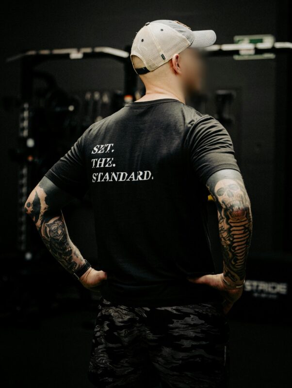 Black T-shirt from The Trace featuring Set the Standard design symbolizing the pursuit of the highest performance