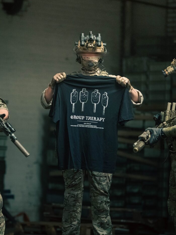 Black tshirt from The Trace featuring Group Therapy design with four targets marked by tight bullet hole groupings