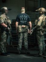 Black T-shirt from The Trace featuring Group Therapy design with four targets marked by tight bullet hole groupings