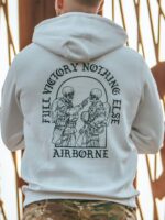 Hoodie featuring World War II design of two soldiers standing before a parachute jump
