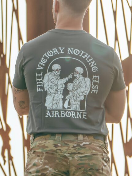 Tshirt featuring World War II design of two soldiers standing before a parachute jump
