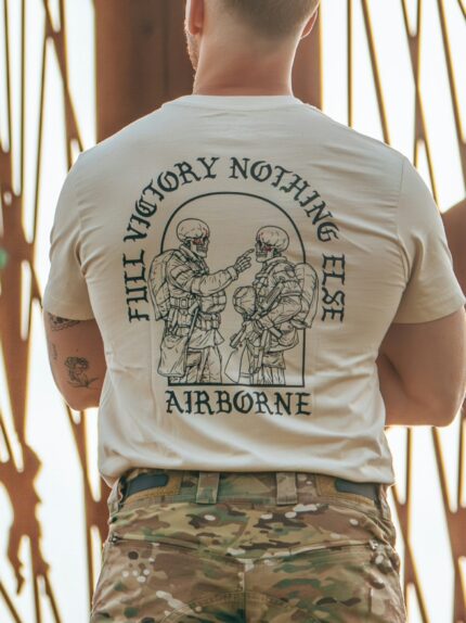 Tshirt featuring World War II design of two soldiers standing before a parachute jump