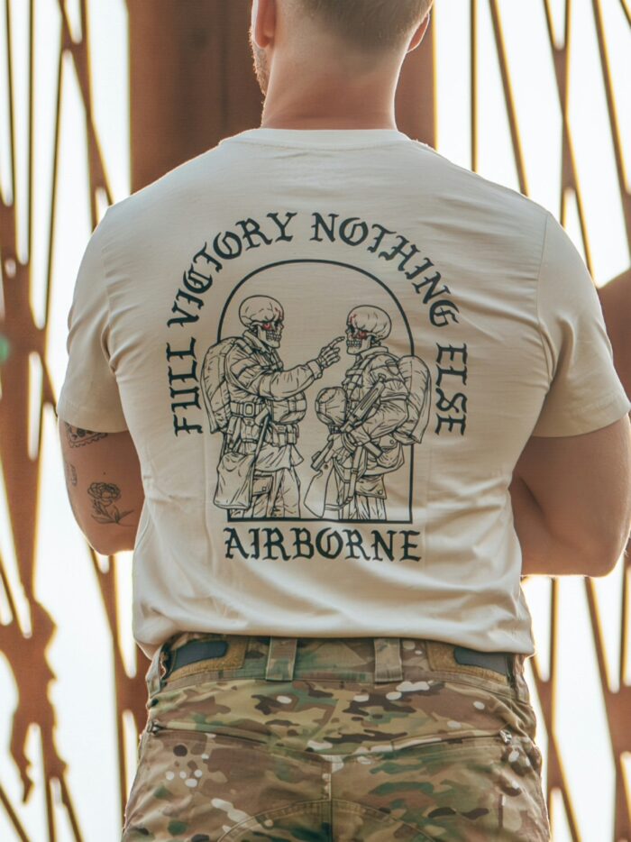 Tshirt featuring World War II design of two soldiers standing before a parachute jump