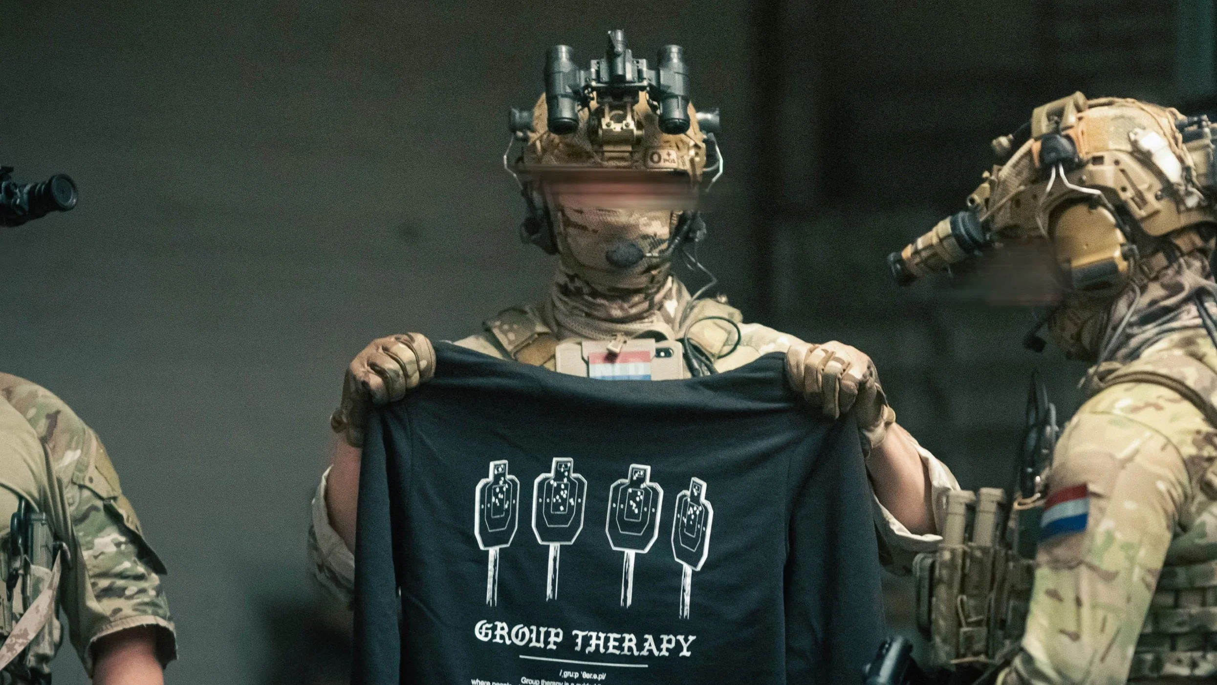 Black hoodie from The Trace featuring Group Therapy design with four targets marked by tight bullet hole groupings