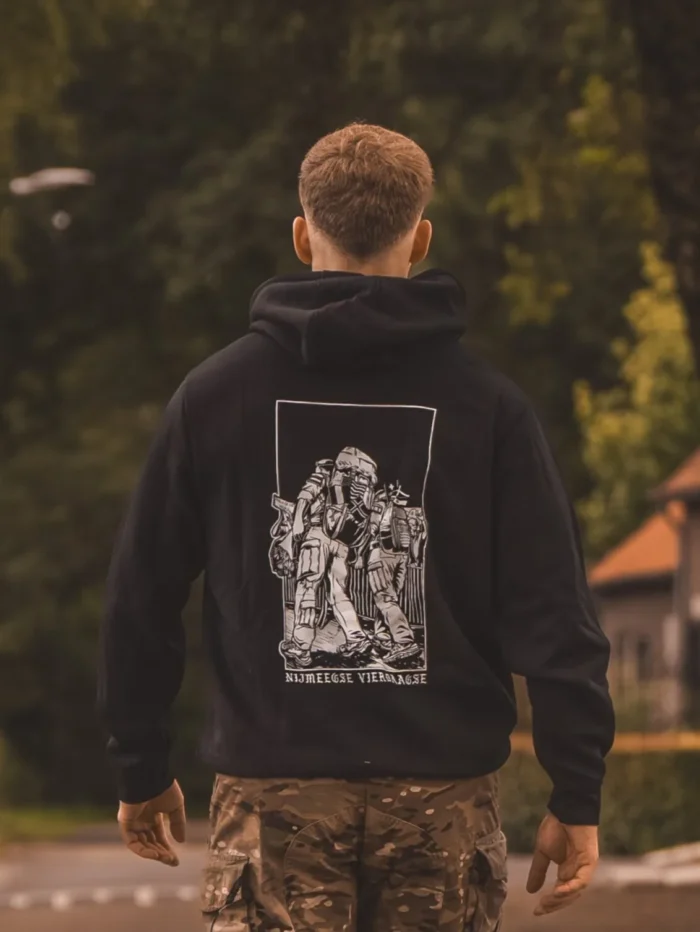 black hoodie from The Trace featuring design of two soldiers marching in the Nijmegen Four Days Marches