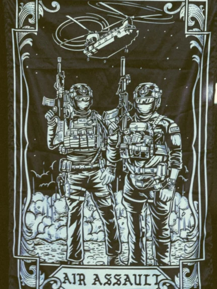 the trace apparel collection featuring 2 air assault operators standing in front of a chinook