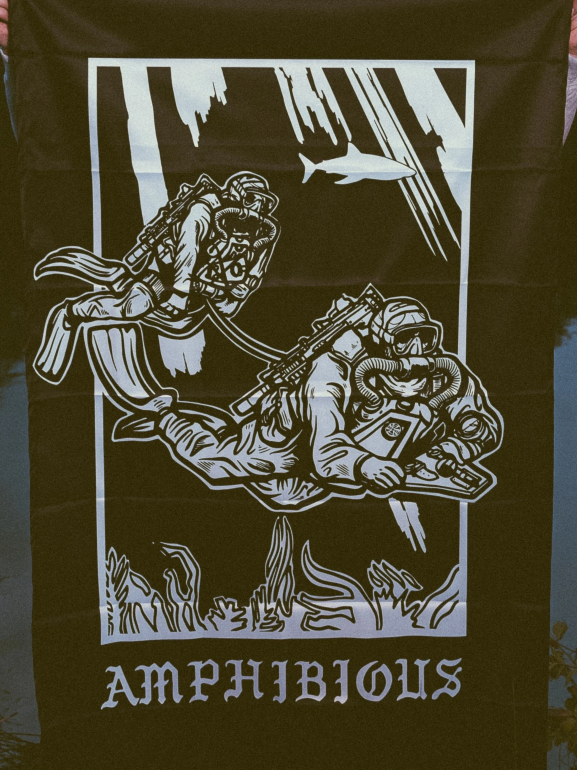 the trace apparel collection featuring two military reconnaissance divers swimming underwater