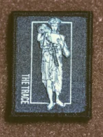 the trace apparel collection patch featuring a woman holding a anti tank weapon