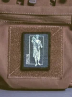 the trace apparel collection patch featuring a woman holding a anti tank weapon