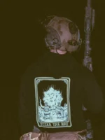 the trace apparel collection with 2 guys sitting in front of a explosing because they are part of the eod