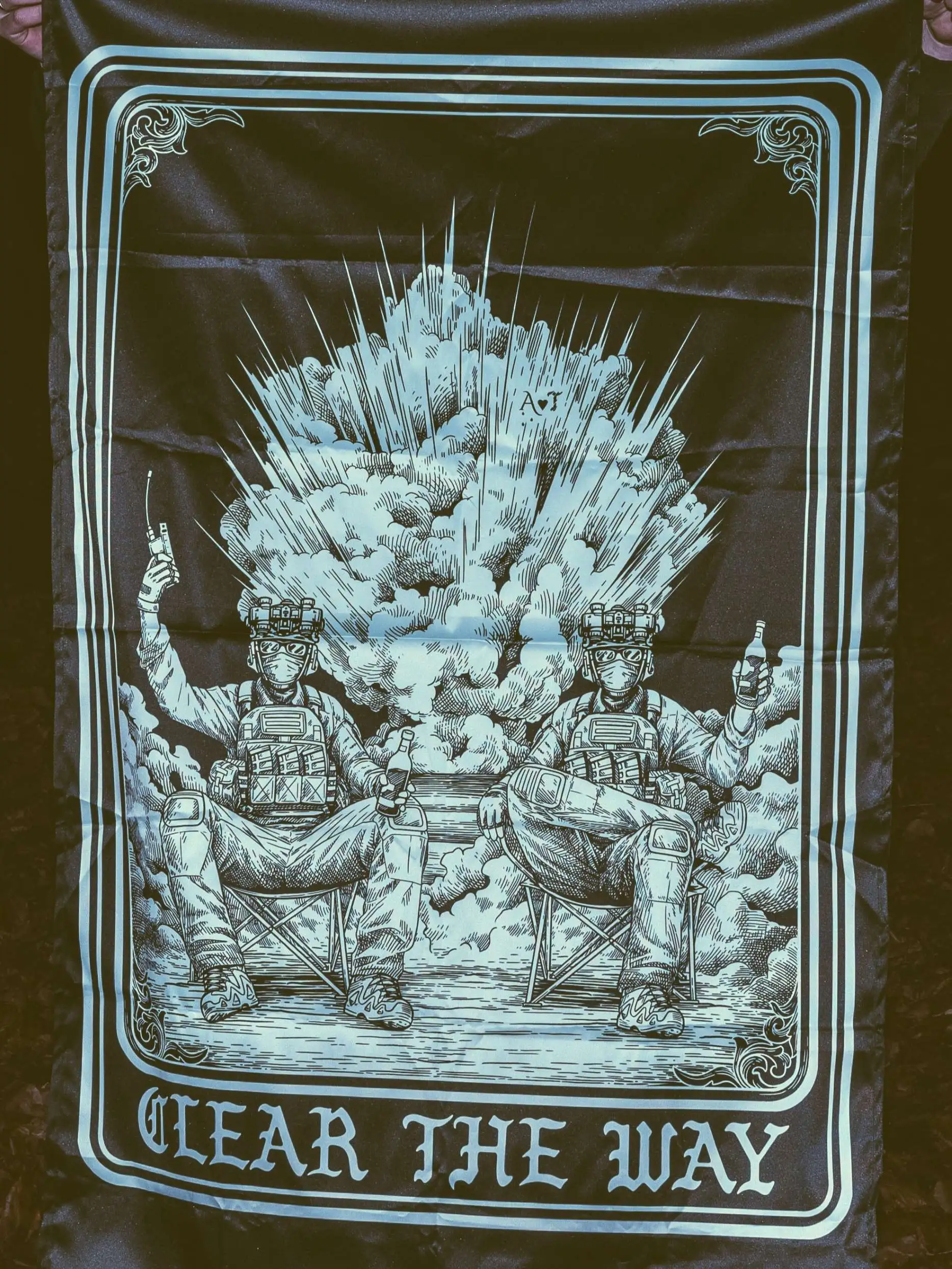 the trace apparel collection with 2 guys sitting in front of a explosing because they are part of the eod