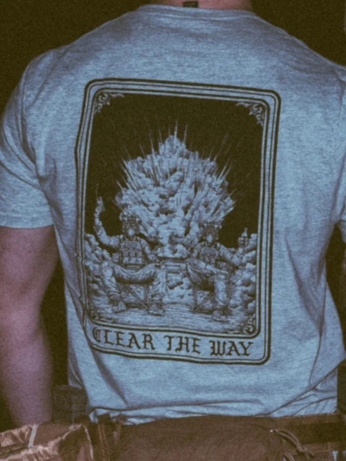 the trace apparel collection with 2 guys sitting in front of a explosing because they are part of the eod