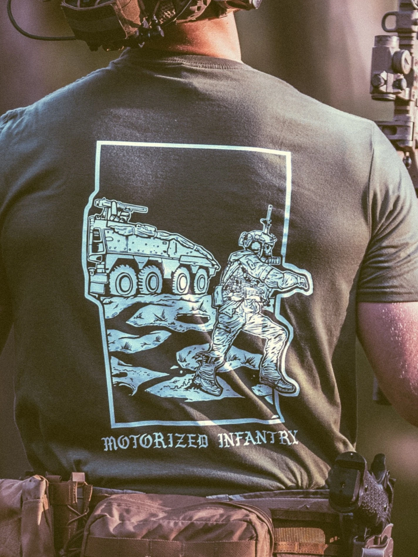 the trace apparel collection featuring guys fighting alongside a military boxer vehicle