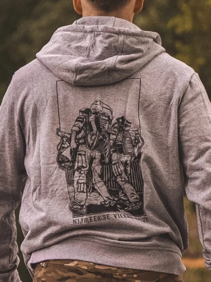 Heather grey from The Trace featuring design of two soldiers marching in the Nijmegen Four Days Marches