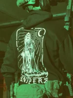 Sniper-themed military hoodie featuring a skeleton standing on skulls, armed with an Accuracy International Arctic Warfare Super Magnum.