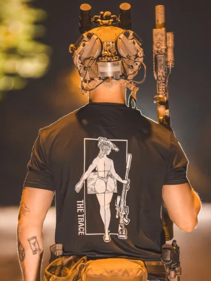 black tshirt from The Trace featuring a girl carrying a sniper weapon.