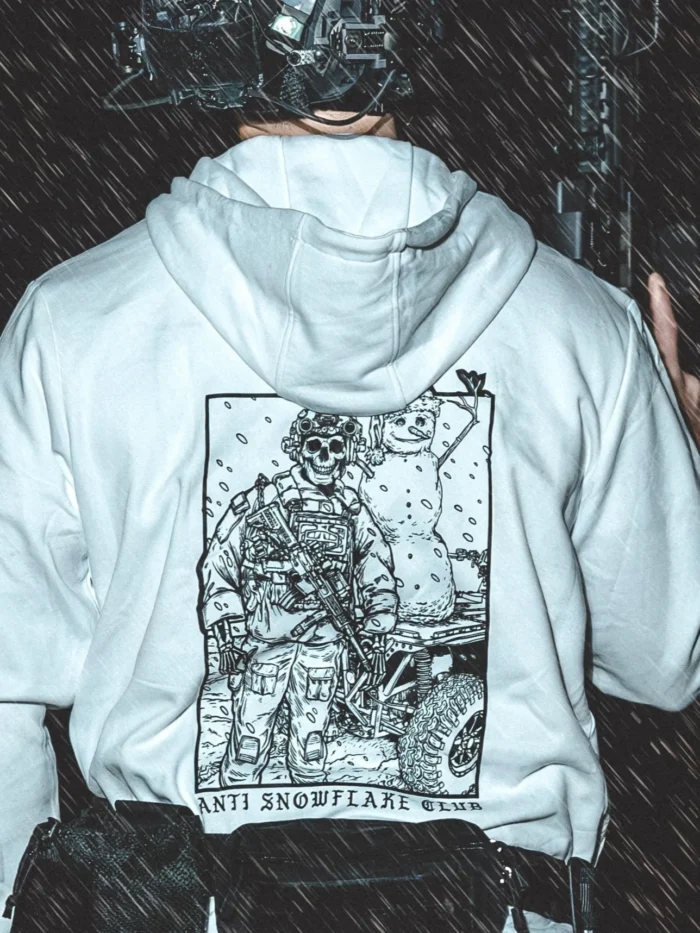 the trace apparel collection featuring a design with a military operator standing next to a snowman with a text saying anti snow flake club