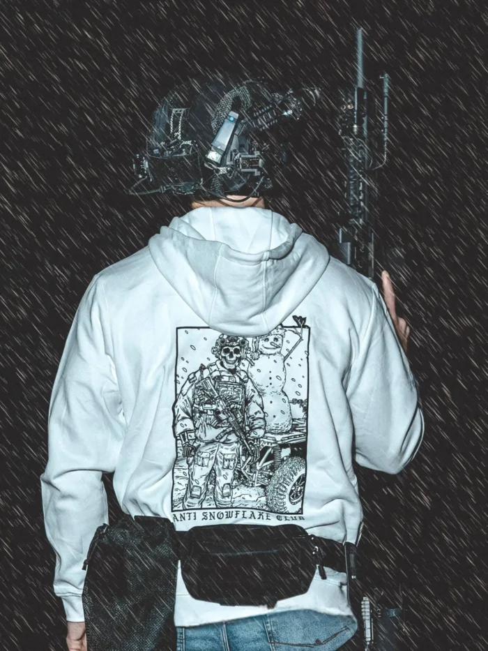 the trace apparel collection featuring a design with a military operator standing next to a snowman with a text saying anti snow flake club