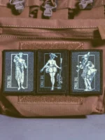 the trace apparel collection patch featuring 3 woman holding a sniper machine gun and anti tank weapon