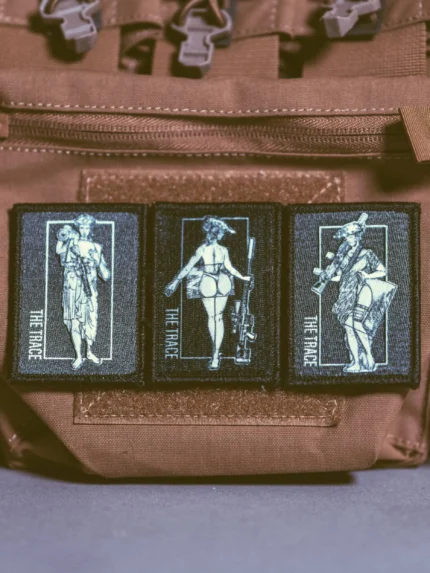 the trace apparel collection patch featuring 3 woman holding a sniper machine gun and anti tank weapon