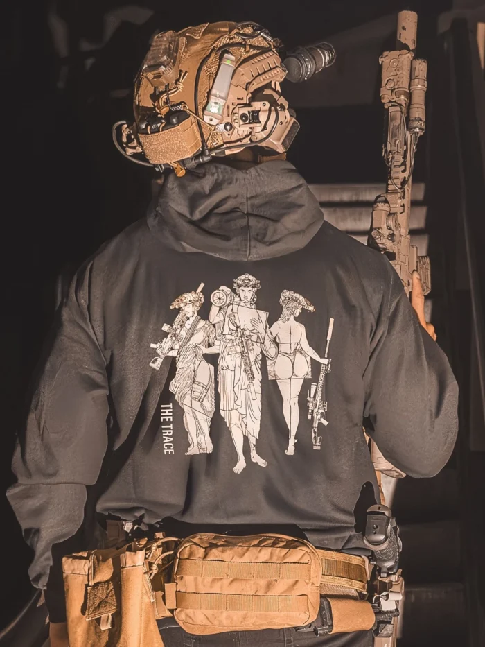 black hoodie from The Trace featuring 3 girls carrying a machinegun sniperrifle and anti tank weapon