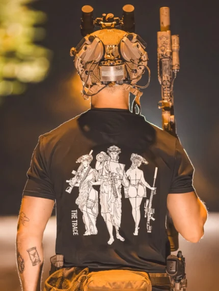 black shirt from The Trace featuring 3 girls carrying a machinegun sniperrifle and anti tank weapon