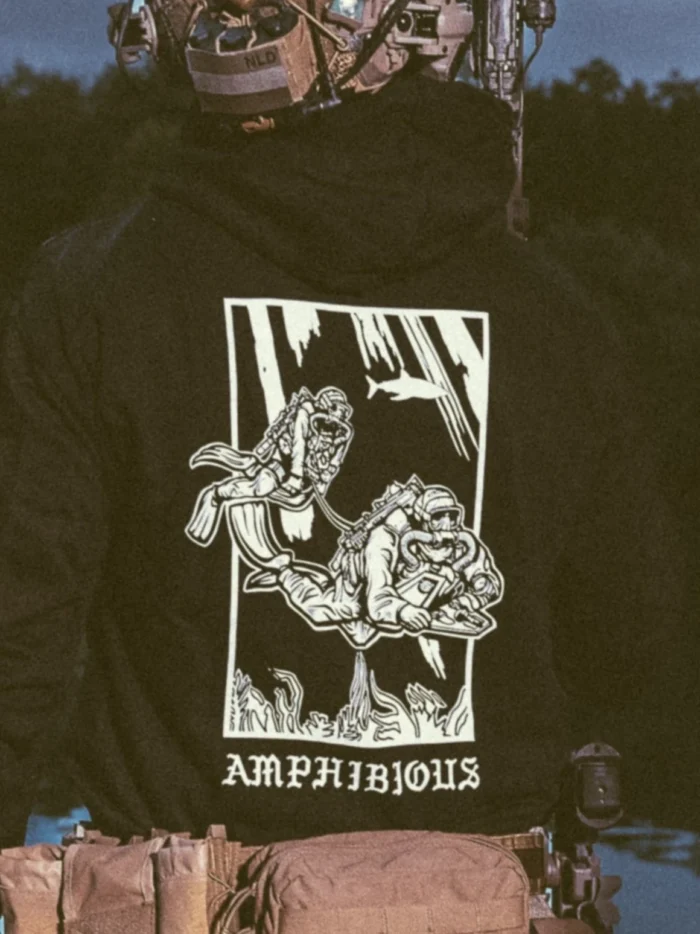 the trace apparel collection featuring two military reconnaissance divers swimming underwater