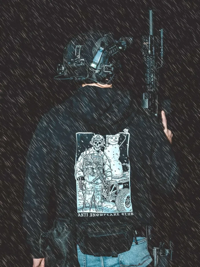 the trace apparel collection featuring a design with a military operator standing next to a snowman with a text saying anti snow flake club