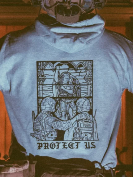 the trace apparel collection featuring a military and a police guy standing in front of a tinted window that displays saint michael the protector