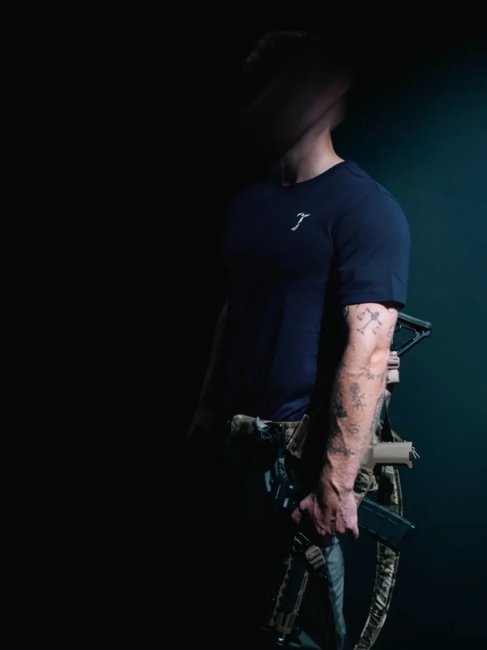 the trace mockup clothing featuring their T logo on the chest and a weapon on the hand