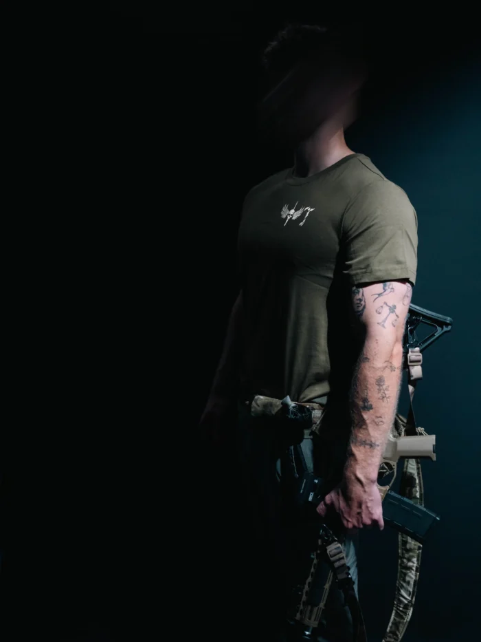 the trace mockup clothing featuring their T logo on the chest and a weapon on the hand