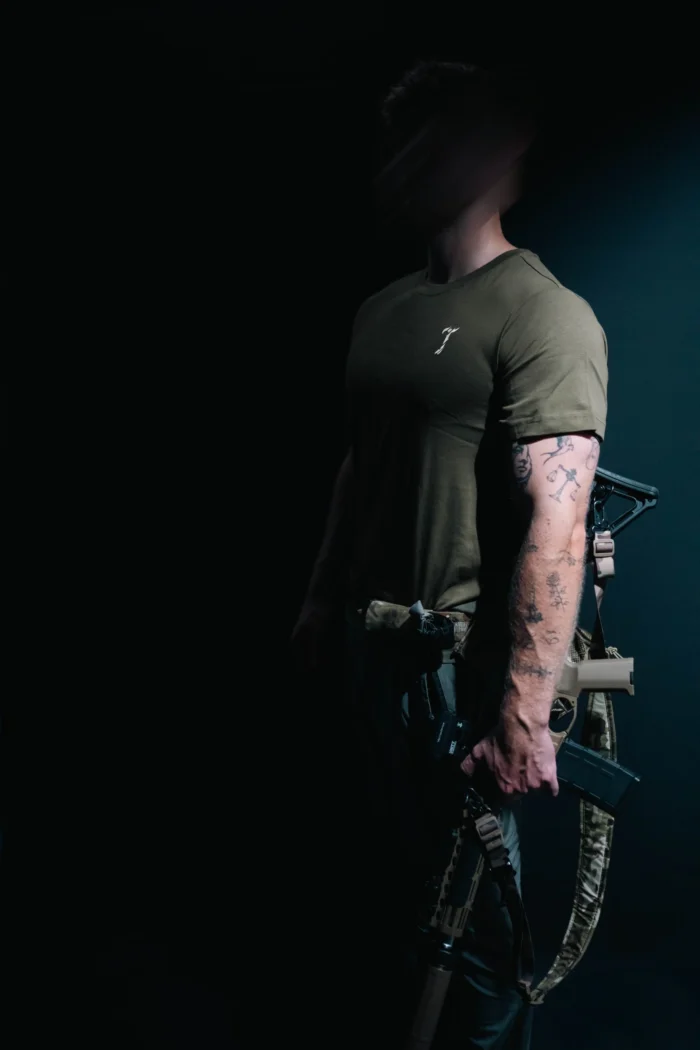 the trace mockup clothing featuring their T logo on the chest and a weapon on the hand