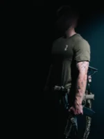 the trace mockup clothing featuring their T logo on the chest and a weapon on the hand