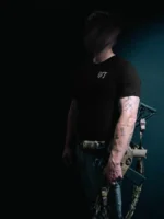 the trace mockup clothing featuring their T logo on the chest and a weapon on the hand