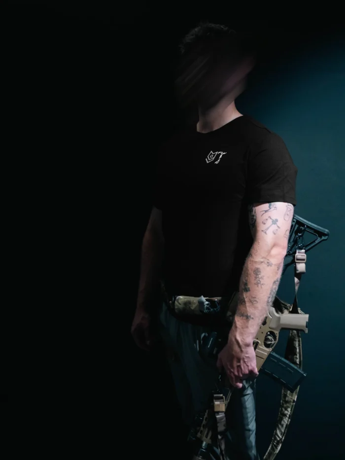 the trace mockup clothing featuring their T logo on the chest and a weapon on the hand