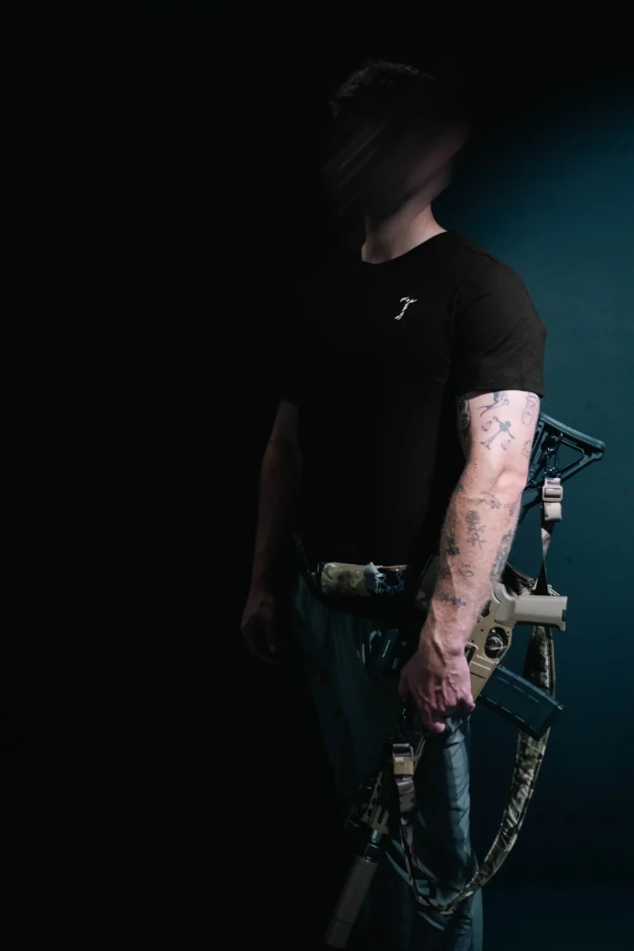 the trace mockup clothing featuring their T logo on the chest and a weapon on the hand