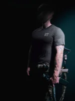 the trace mockup clothing featuring their T logo on the chest and a weapon on the hand