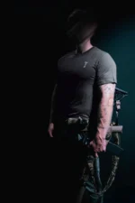 the trace mockup clothing featuring their T logo on the chest and a weapon on the hand