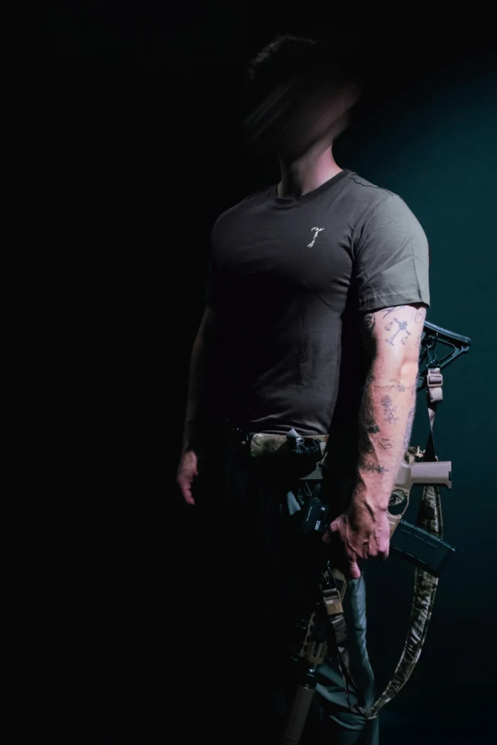 the trace mockup clothing featuring their T logo on the chest and a weapon on the hand