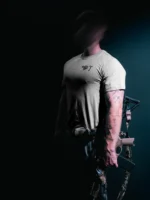the trace mockup clothing featuring their T logo on the chest and a weapon on the hand